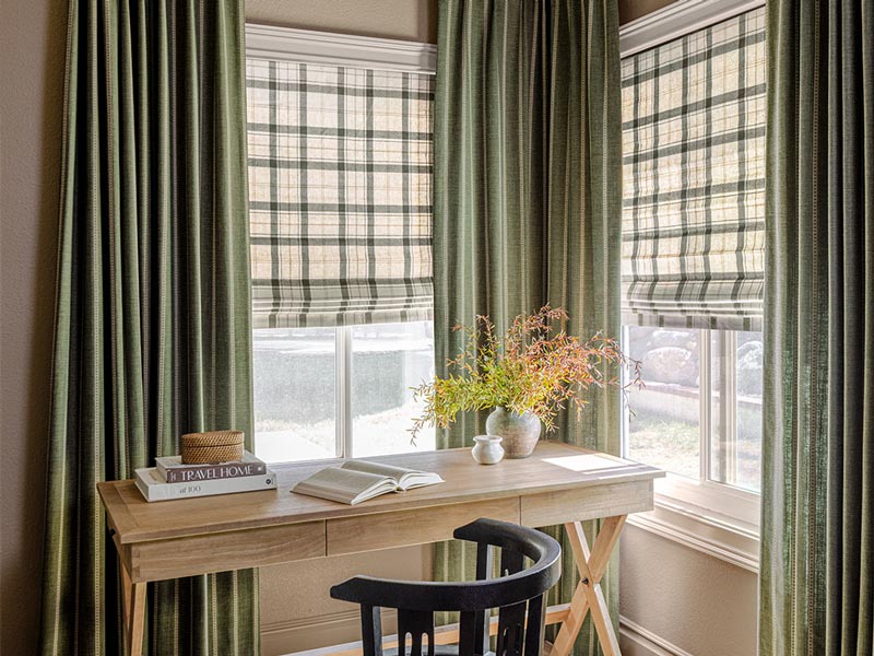 green drapery and white and green plaid shades